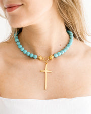 HANDCAST LONG GOLD CROSS ON MATTE TURQUOISE NECKLACE