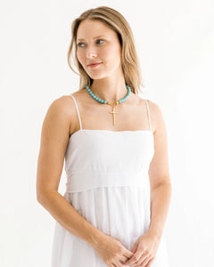 HANDCAST LONG GOLD CROSS ON MATTE TURQUOISE NECKLACE