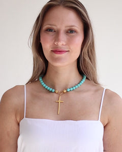 HANDCAST LONG GOLD CROSS ON MATTE TURQUOISE NECKLACE